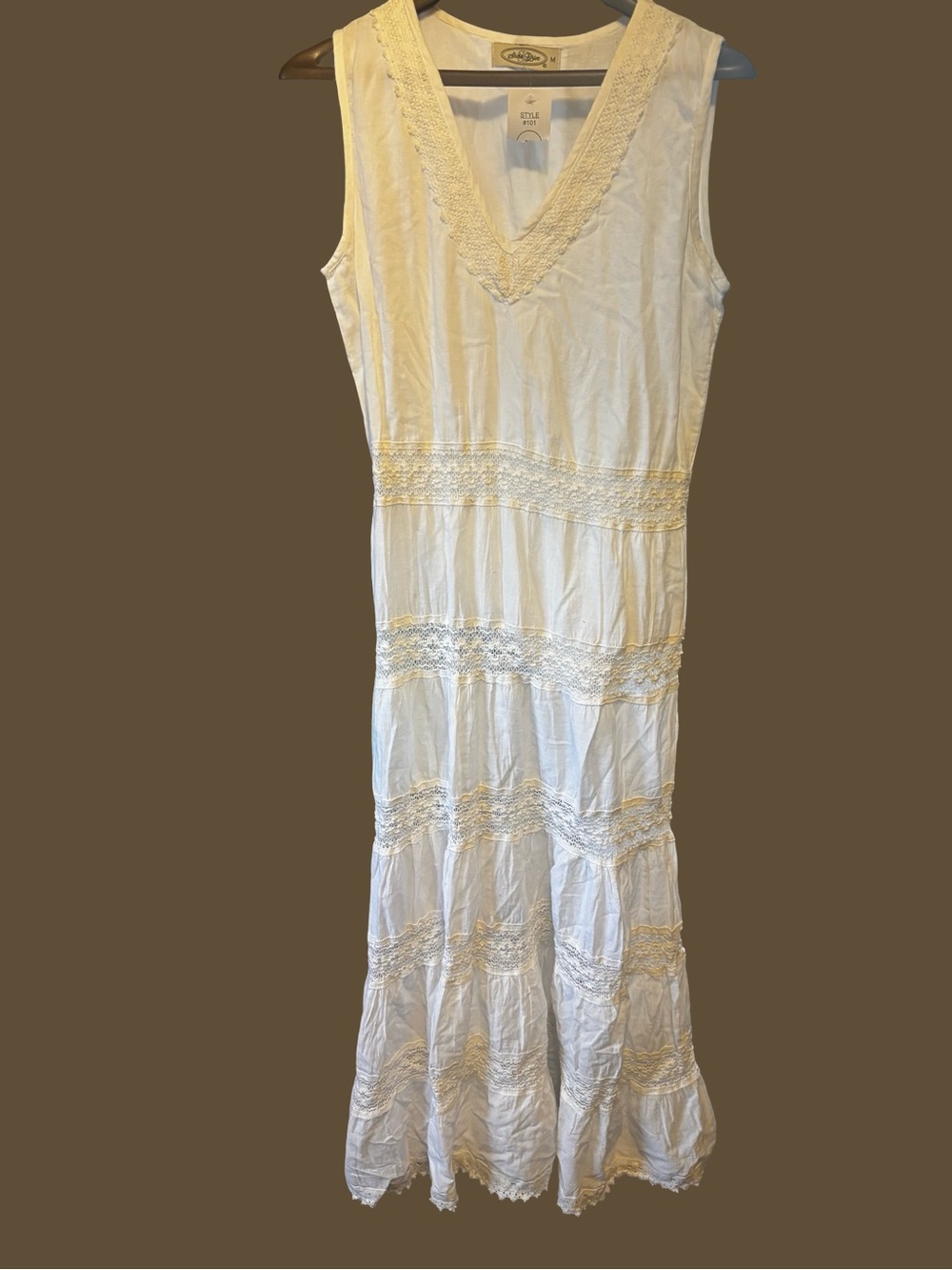 Sleeveless Cream Maxi Dress with V-Neck and Lace Panels